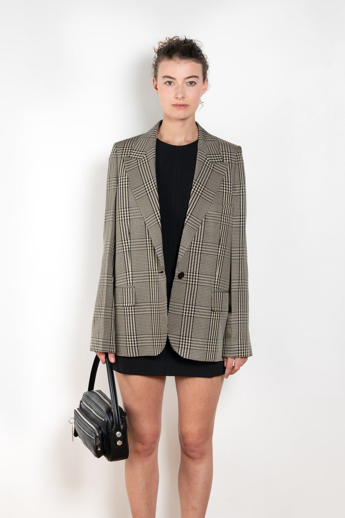 The Check Suit Jacketby Acne Studios is a single-breasted suit jacket with a check bicolour pattern
