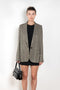 The Check Suit Jacketby Acne Studios is a single-breasted suit jacket with a check bicolour pattern