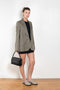 The Check Suit Jacketby Acne Studios is a single-breasted suit jacket with a check bicolour pattern