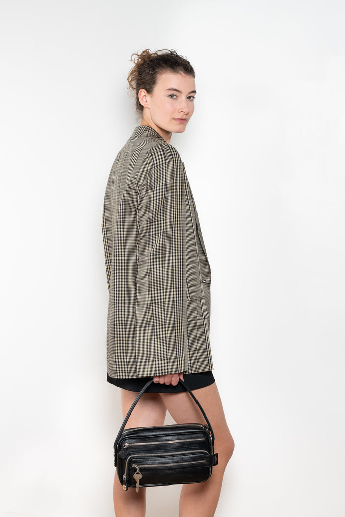 The Check Suit Jacketby Acne Studios is a single-breasted suit jacket with a check bicolour pattern