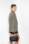 The Check Suit Jacketby Acne Studios is a single-breasted suit jacket with a check bicolour pattern