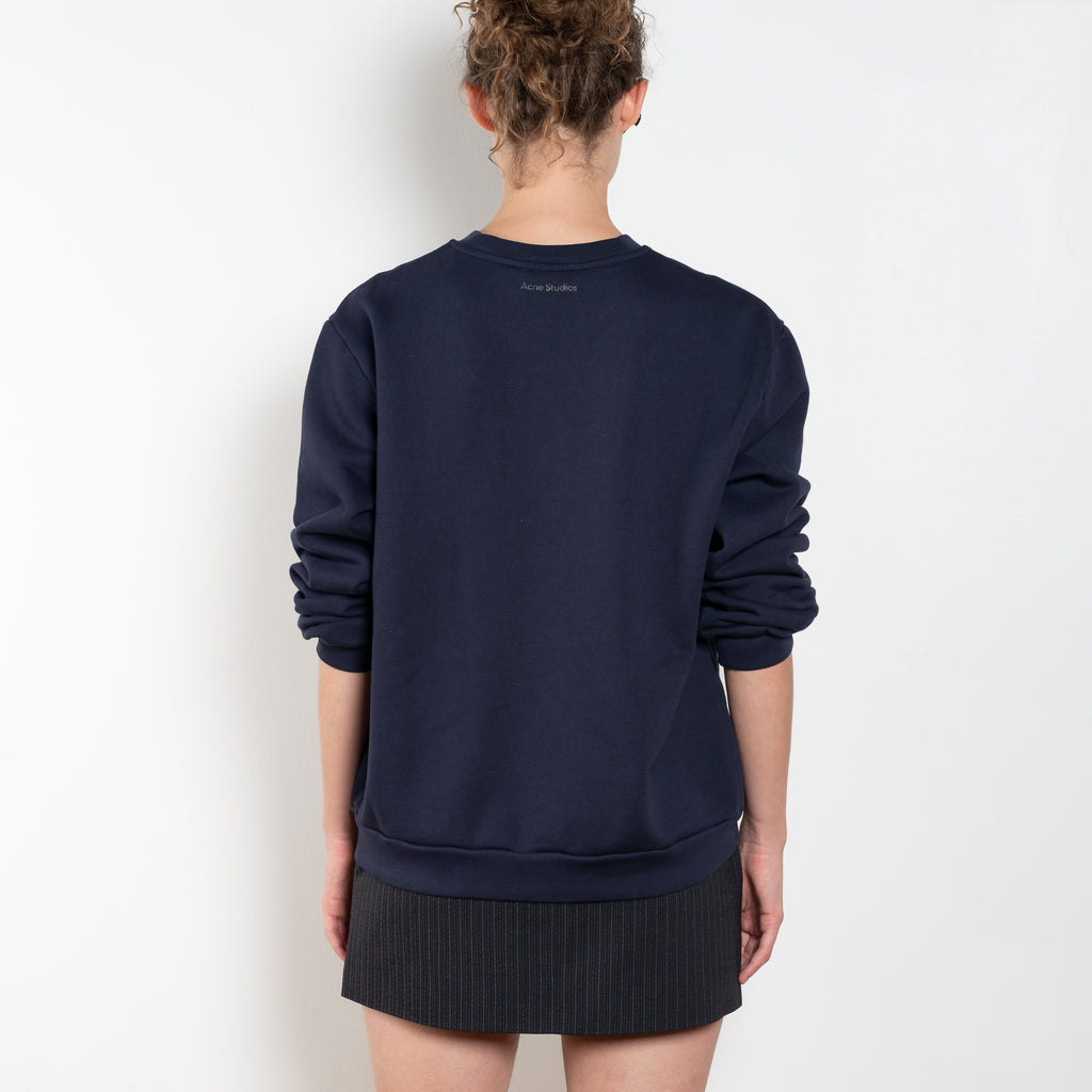 The Crew Neck Fleece Sweater by Acne Studios is made from a fleece cotton with a soft brushed finish, adorned with a seasonal Face logo embroidery and branding at the back