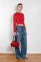 The Cropped Crewneck Sweater by Acne Studios has a fitted silhouette, featuring 3/4-length sleeves and a cropped length