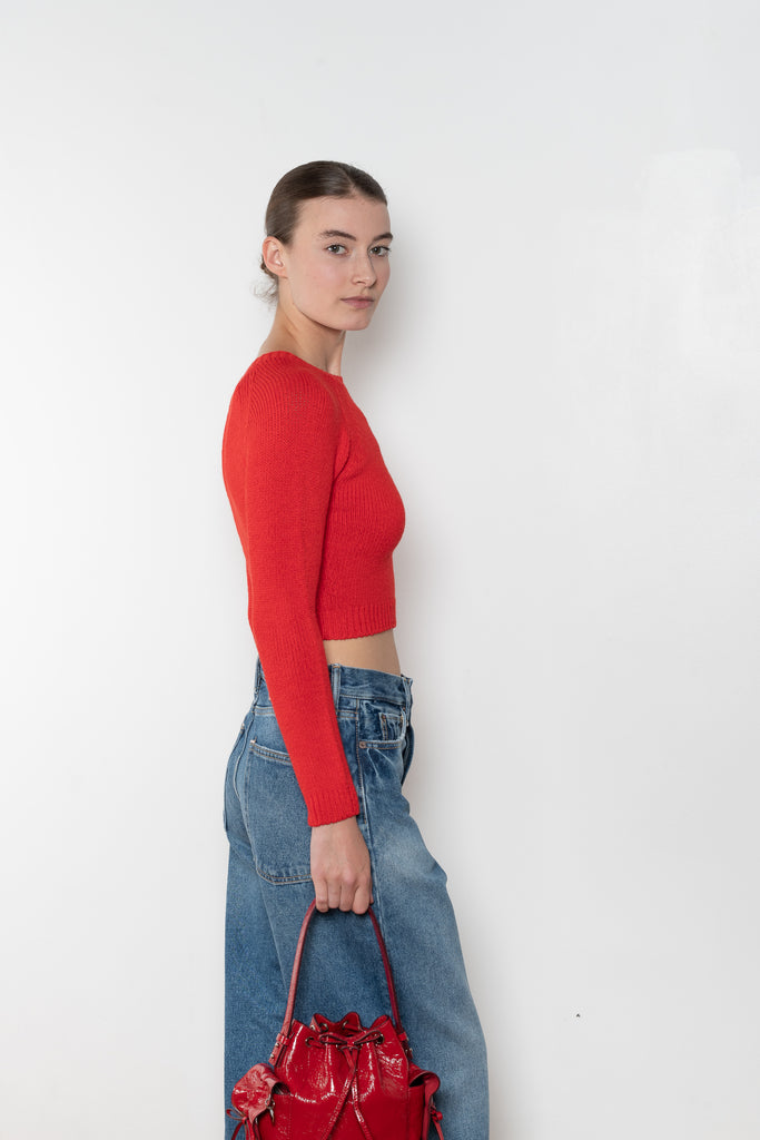 The Cropped Crewneck Sweater by Acne Studios has a fitted silhouette, featuring 3/4-length sleeves and a cropped length