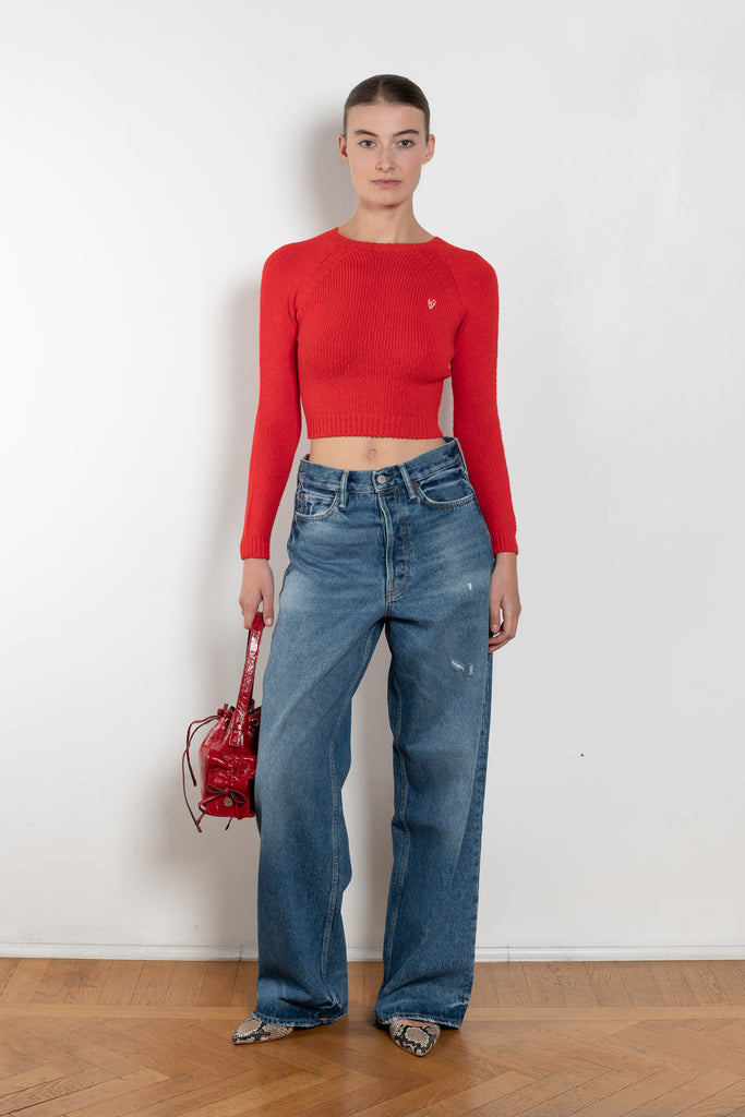 The Cropped Crewneck Sweater by Acne Studios has a fitted silhouette, featuring 3/4-length sleeves and a cropped length