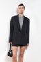 The Pinstripe Jacket by Acne Studios is a double-breasted suit jacket in a wool blend yarn pinstripe woven in a fine herringbone structure and drape finish
