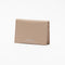 The Folded Leather Wallet by Acne Studios features a folded opening with card slot compartments, crafted from smooth leather and detailed with an Acne Studios logo on the front