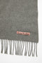 The Oversized Fringed Scarf by Acne Studios is crafted from midweight wool with a soft hand-feel, detailed with a pink Acne Studios label
