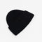 The Small Face Logo Beanie by Acne Studios features a small embroidered face logo patch and ribbed detailing, crafted from chunky wool.
