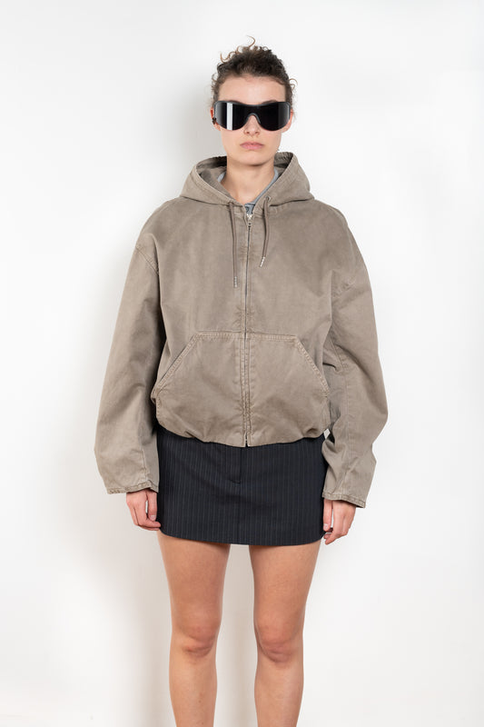 The Hooded Bomber Jacketby Acne Studios is crafted from twill cotton with a garment-dyed finish,  centre front zipper closure, side pockets and elasticated waistband