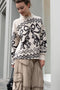 The Jacquard Sweater 818 by Acne Studios is a crew neck sweater with a relaxed fit and below hip length. Detailed with an all-over jacquard seasonal animation.