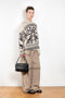 The Jacquard Sweater 818 by Acne Studios is a crew neck sweater with a relaxed fit and below hip length. Detailed with an all-over jacquard seasonal animation.