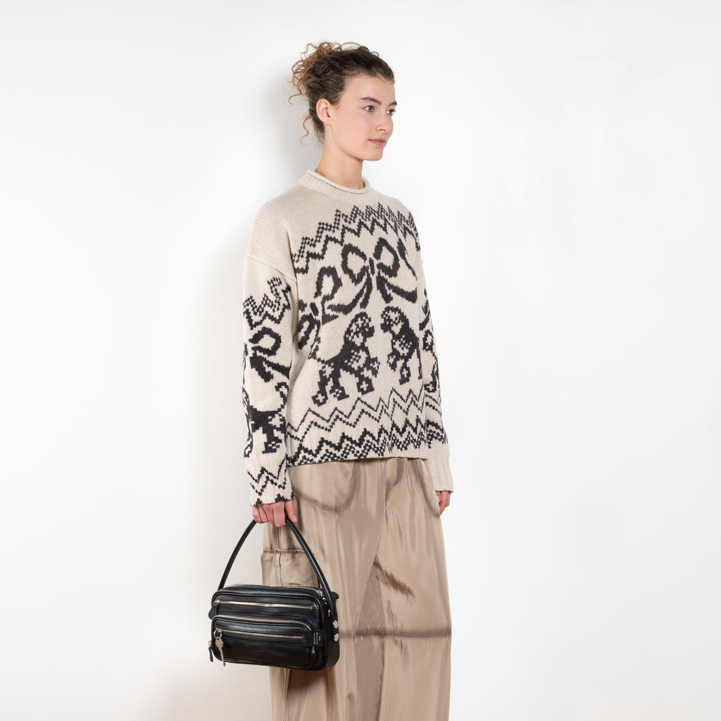 The Jacquard Sweater 818 by Acne Studios is a crew neck sweater with a relaxed fit and below hip length. Detailed with an all-over jacquard seasonal animation.