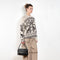 The Jacquard Sweater 818 by Acne Studios is a crew neck sweater with a relaxed fit and below hip length. Detailed with an all-over jacquard seasonal animation.