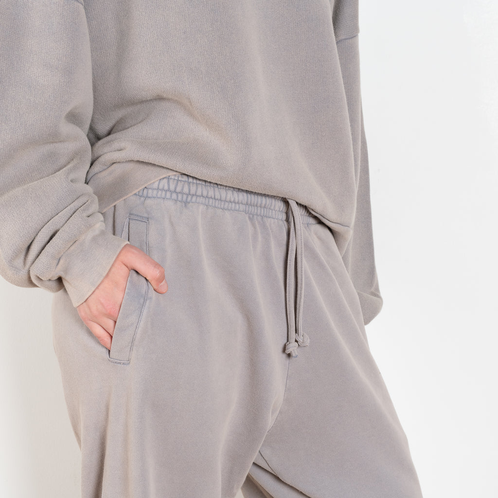 The Jogging 0015 by Acne Studios are mid waist joggers with an elastic waistband and a small rubber logo patch on the back center