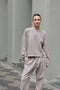 The Jogging 0015 by Acne Studios are mid waist joggers with an elastic waistband and a small rubber logo patch on the back center
