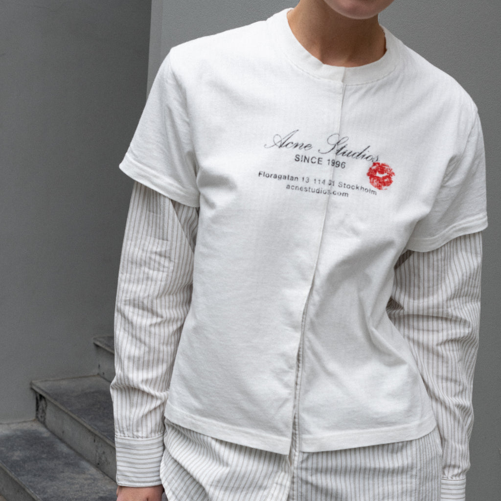 The Layered Shirt by Acne Studios is a layered t-shirt with a relaxed fit and integrated long sleeve shirt with base-ball inspirations