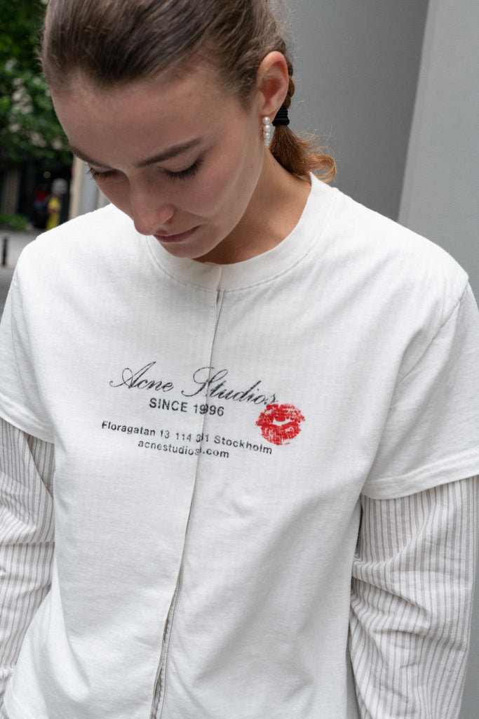 The Layered Shirt by Acne Studios is a layered t-shirt with a relaxed fit and integrated long sleeve shirt with base-ball inspirations