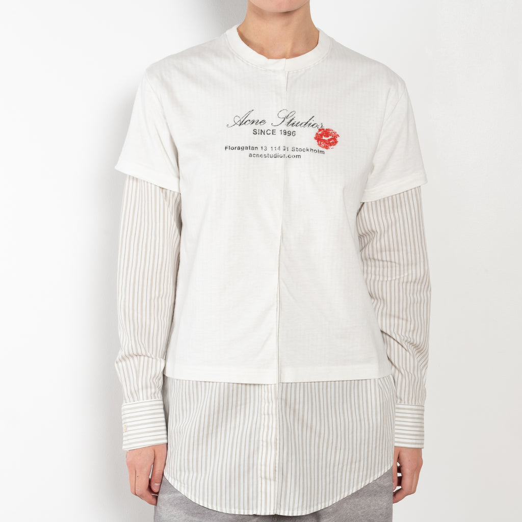 The Layered Shirt by Acne Studios is a layered t-shirt with a relaxed fit and integrated long sleeve shirt with base-ball inspirations