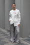 The Layered Shirt by Acne Studios is a layered t-shirt with a relaxed fit and integrated long sleeve shirt with base-ball inspirations