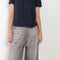 The Loose fit trousers by Acne Studios are fleece melange cotton joggers with a garment dyed finish and leather logo patch at the back
