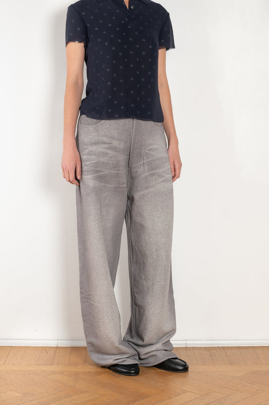 The Loose fit trousers by Acne Studios are fleece melange cotton joggers with a garment dyed finish and leather logo patch at the back
