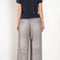 The Loose fit trousers by Acne Studios are fleece melange cotton joggers with a garment dyed finish and leather logo patch at the back