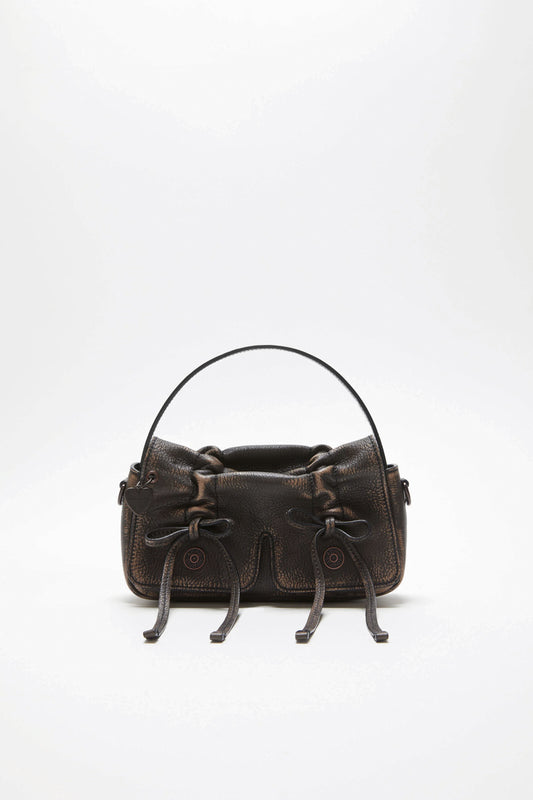 The Multipocket Micro Bag by Acne Studios is crafted from leather with a washed finish and laced knot details