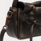The Multipocket Micro Bag by Acne Studios is crafted from leather with a washed finish and laced knot details