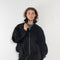 The Nylon Jacket by Acne Studios is crafted in a technical nylon with a peach finish. Constructed with a high neckline