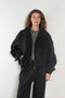 The Nylon Jacket by Acne Studios is crafted in a technical nylon with a peach finish. Constructed with a high neckline