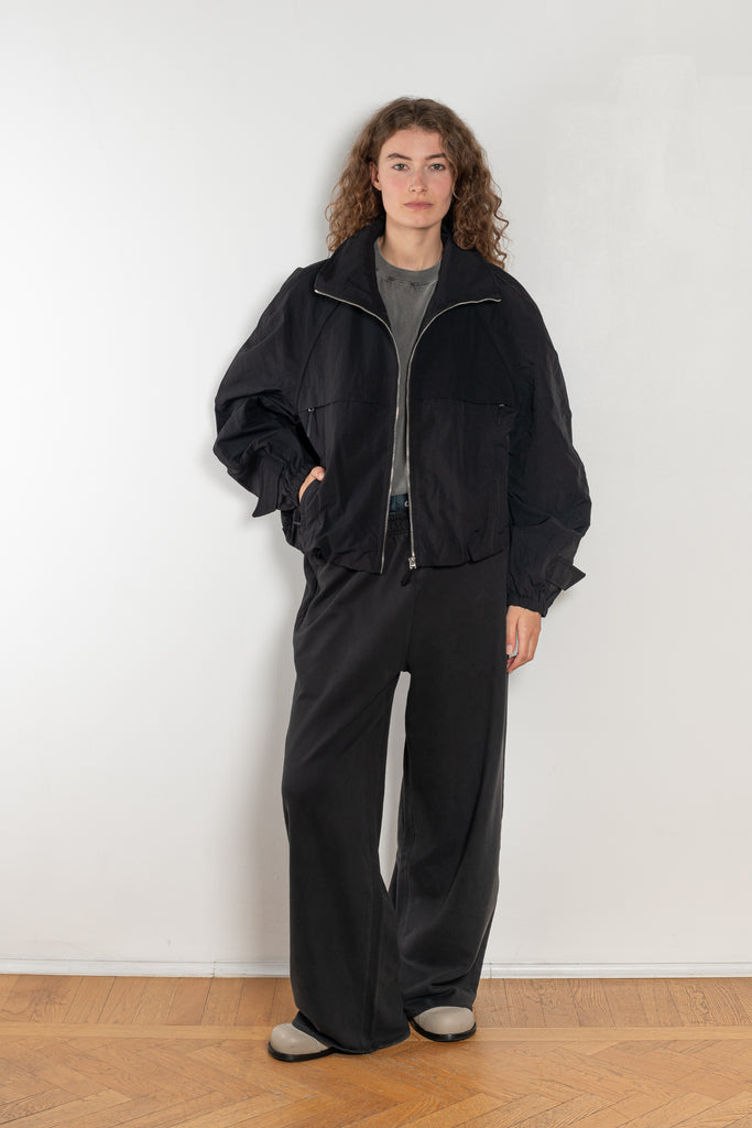 The Nylon Jacket by Acne Studios is crafted in a technical nylon with a peach finish. Constructed with a high neckline