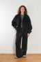 The Nylon Jacket by Acne Studios is crafted in a technical nylon with a peach finish. Constructed with a high neckline