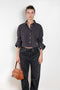 The Shirt Jacquard Pinstripe by Acne Studios is a button-up shirt in poplin cotton with a contrast bow embroidery