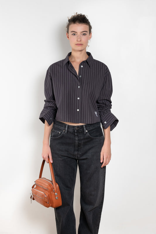 The Shirt Jacquard Pinstripe by Acne Studios is a button-up shirt in poplin cotton with a contrast bow embroidery