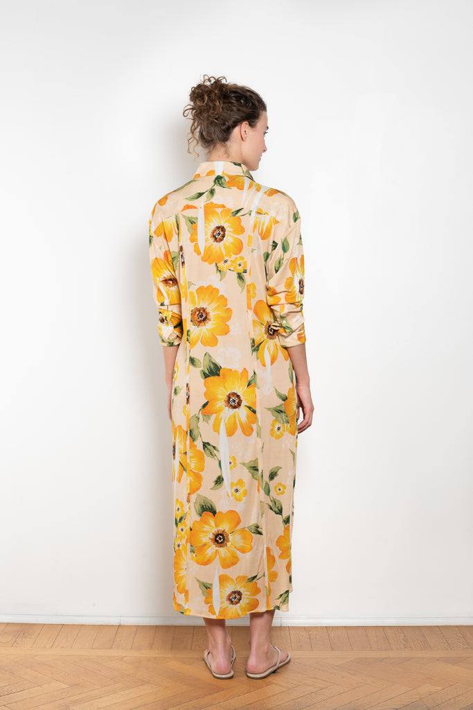 The Printed Dress by Acne Studios is a long sleeve shirt dress crafted in a fluid jersey adorned with a season flower print