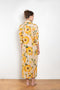 The Printed Dress by Acne Studios is a long sleeve shirt dress crafted in a fluid jersey adorned with a season flower print