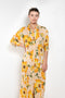 The Printed Dress by Acne Studios is a long sleeve shirt dress crafted in a fluid jersey adorned with a season flower print
