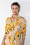 The Printed Dress by Acne Studios is a long sleeve shirt dress crafted in a fluid jersey adorned with a season flower print