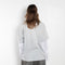 The Layered Print Tee by Acne Studios has a relaxed fit with under-layer mesh long sleeves and distressed neckline
