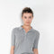 The Short sleeve polo shirt by Acne Studios is a lightweight ribbed silk polo top, detailed with a silver-toned logo engraved heart charm at the back