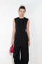 The Short Sleeve Dress by Acne Studios is a tailored dress made from a wool blend, detailed with darts along the waist