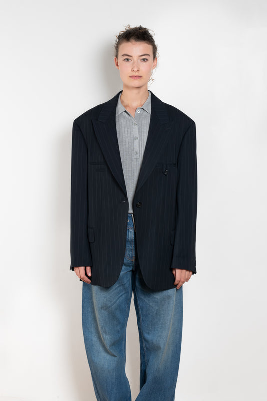 The Single-breasted suit jacket by Acne Studios is crafted in a dense sartorial pinstripe fabric