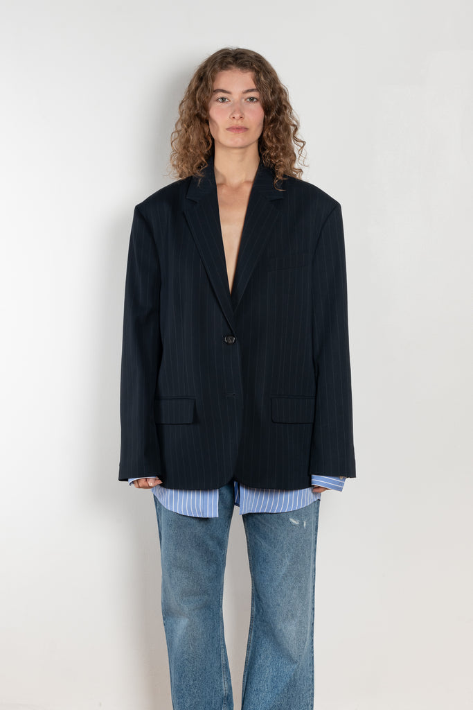 The Single-breasted suit jacket by Acne Studios is crafted fluid pinstriped fabric with layered shirting detailing