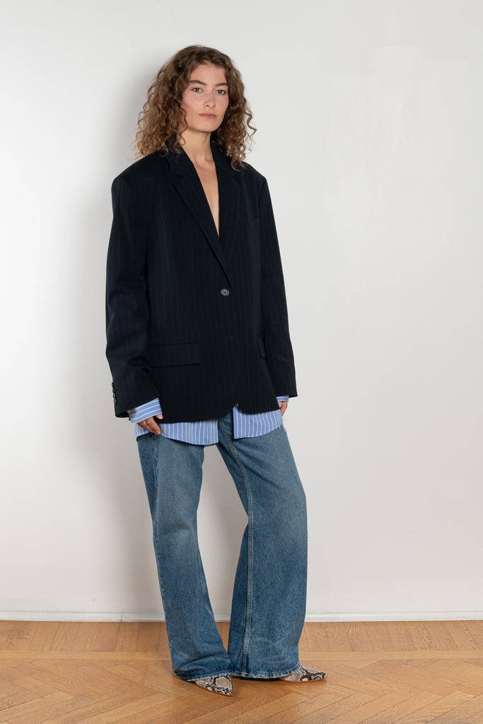 The Single-breasted suit jacket by Acne Studios is crafted fluid pinstriped fabric with layered shirting detailing