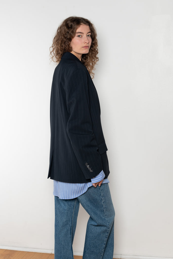 The Single-breasted suit jacket by Acne Studios is crafted fluid pinstriped fabric with layered shirting detailing