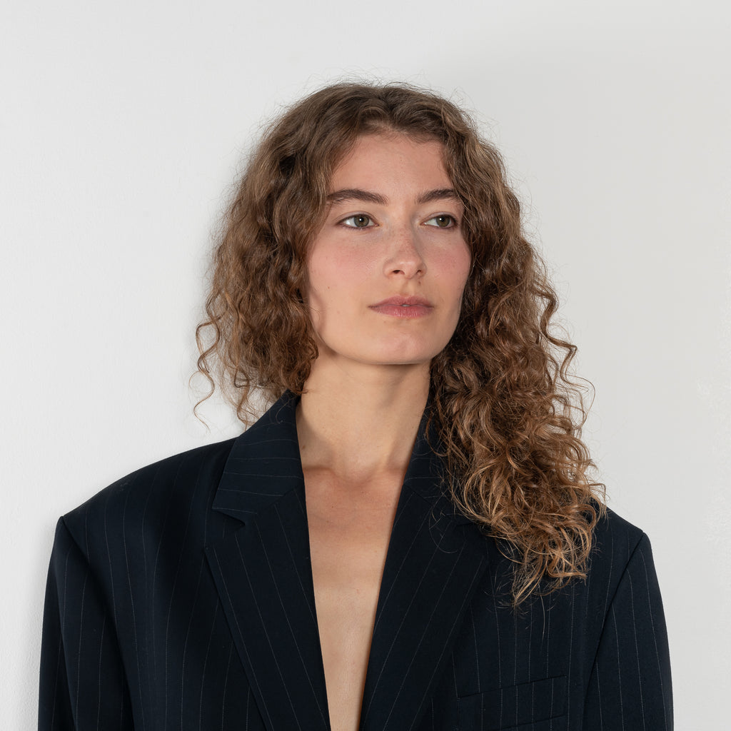 The Single-breasted suit jacket by Acne Studios is crafted fluid pinstriped fabric with layered shirting detailing