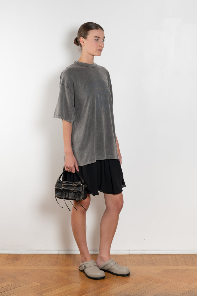 The Tshirt Dress by Acne Studios is a short-sleeve T-shirt dress featuring a layered construction