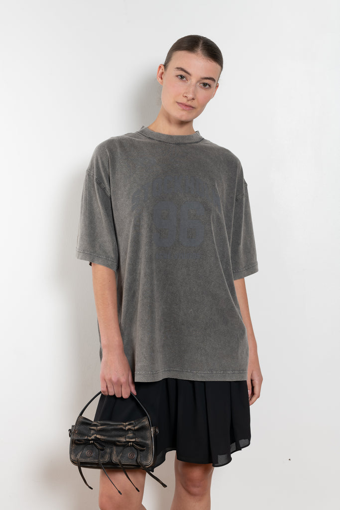 The Tshirt Dress by Acne Studios is a short-sleeve T-shirt dress featuring a layered construction