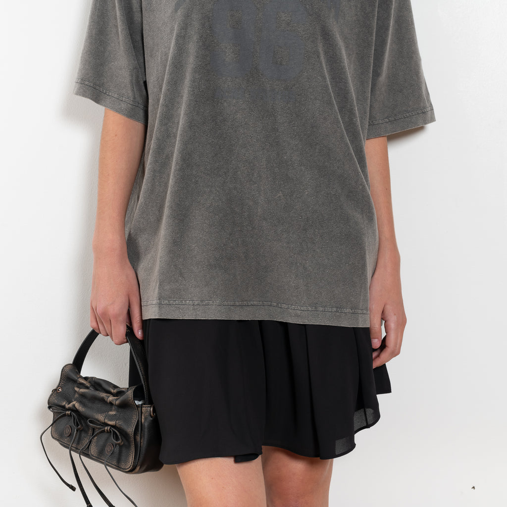 The Tshirt Dress by Acne Studios is a short-sleeve T-shirt dress featuring a layered construction